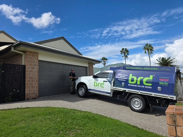 Brisbane Roller Doors technician repairing a garage door