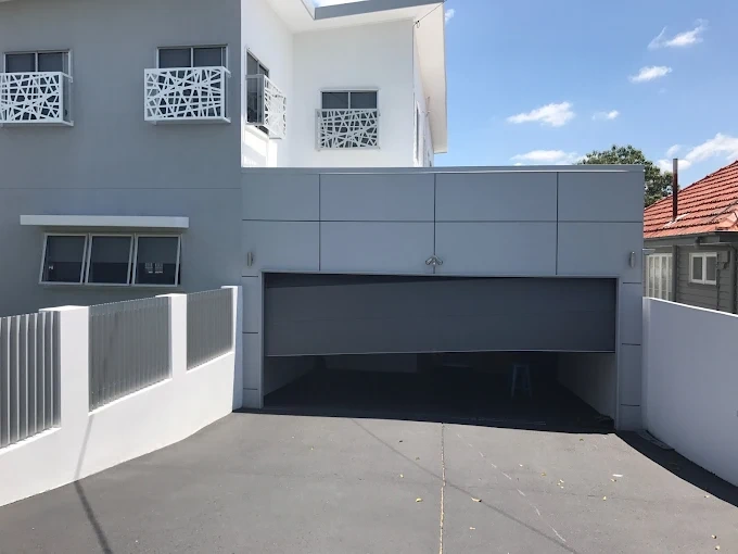 Brisbane Roller Doors technician repairing a garage door