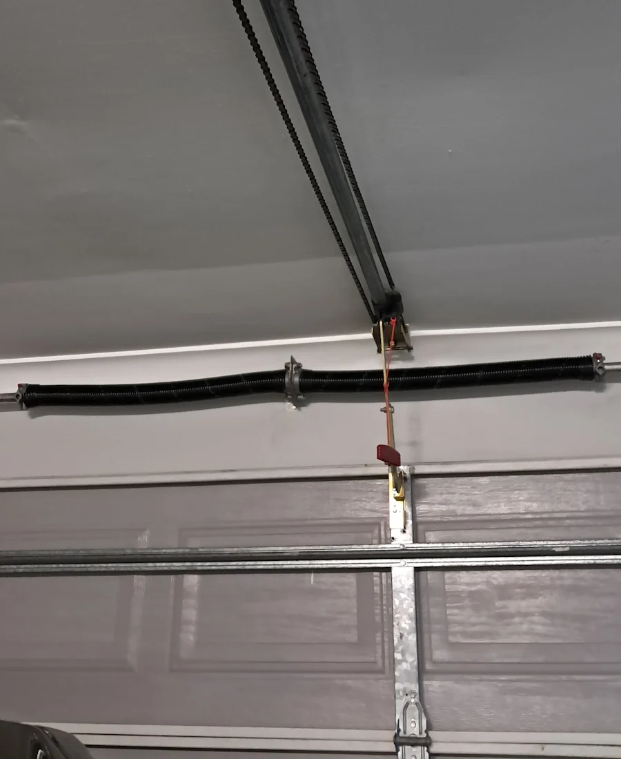 Brisbane Roller Doors technician repairing a garage door
