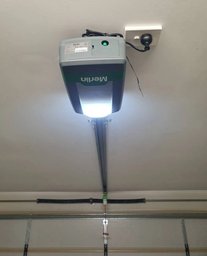 Brisbane Roller Doors technician repairing a garage door