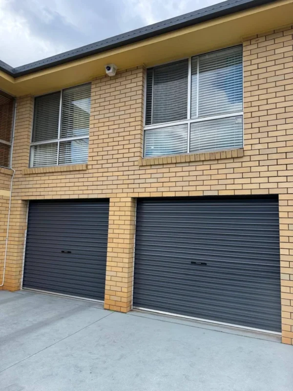Brisbane Roller Doors technician repairing a garage door